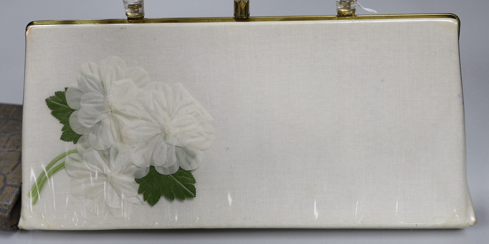 Two 1960's gilt metal ladies evening bags, a metal and wooden bag, a 1950's plastic and fabric bag possibly American, a 1930's faux crocodile clutch bag and a 1930's stripe clutch bag